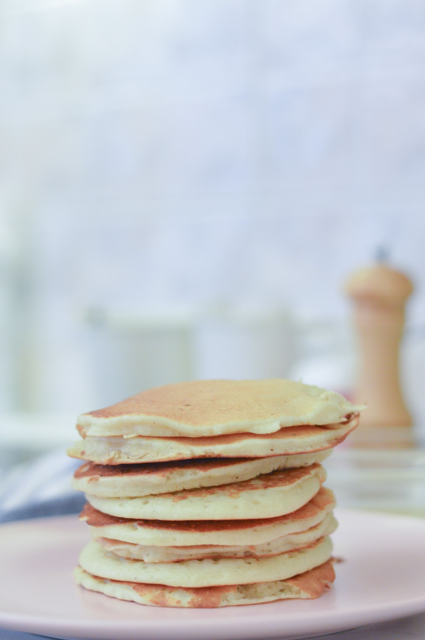 A small stack of pancakes on a plate